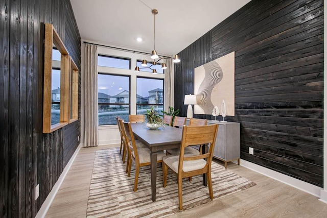 19125 Hopper Ln, Austin, TX 78738 - dining area with wood walls, wood finished floors, and recessed lighting