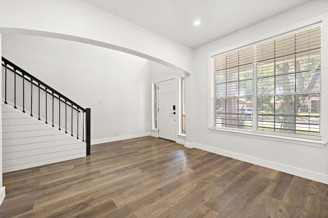 2208 Drue Ln, Cedar Park, TX 78613 - foyer entrance with wood finished floors, stairway, arched walkways, and recessed lighting
