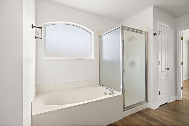 2208 Drue Ln, Cedar Park, TX 78613 - bathroom with a stall shower, a bath, and wood finished floors