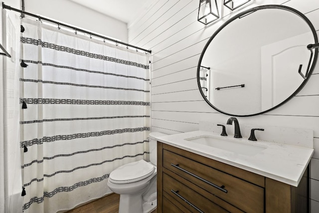 2208 Drue Ln, Cedar Park, TX 78613 - bathroom with vanity, wood finished floors, a shower with curtain, and wooden walls