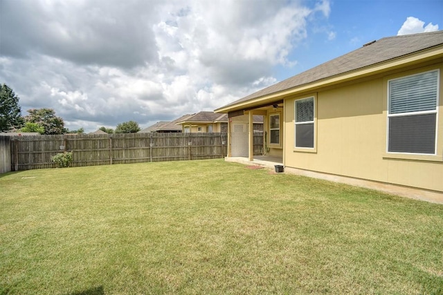 306 Grutsch Dr, Bastrop, TX 78602 - fenced backyard with a ceiling fan