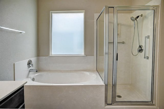 306 Grutsch Dr, Bastrop, TX 78602 - full bathroom featuring a stall shower, a bath, and vanity