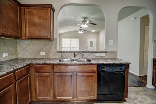 306 Grutsch Dr, Bastrop, TX 78602 - kitchen with black dishwasher, ceiling fan, lofted ceiling, tasteful backsplash, and arched walkways