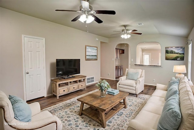 306 Grutsch Dr, Bastrop, TX 78602 - living room featuring a ceiling fan, arched walkways, and wood finished floors