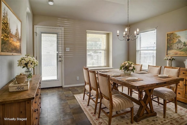 306 Grutsch Dr, Bastrop, TX 78602 - dining space with a chandelier, plenty of natural light, and stone finish floors