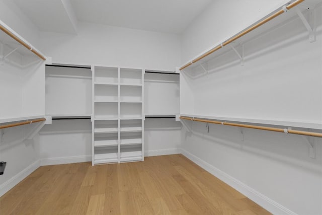 7705 Calcutta Run Dr, Jonestown, TX 78645 - walk in closet featuring wood finished floors