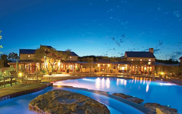 7705 Calcutta Run Dr, Jonestown, TX 78645 - view of swimming pool with a patio and a pool with connected hot tub