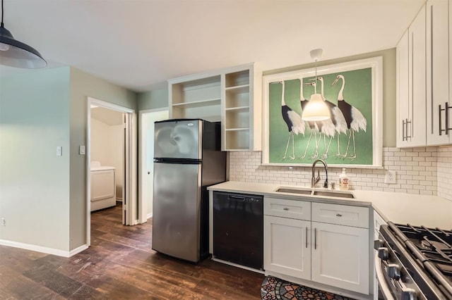 1610 Broadmoor Dr, Austin, TX 78723 - kitchen featuring stainless steel appliances, washer / clothes dryer, dark wood finished floors, and decorative backsplash