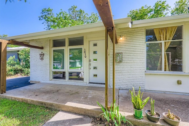 1610 Broadmoor Dr, Austin, TX 78723 - view of exterior entry with brick siding