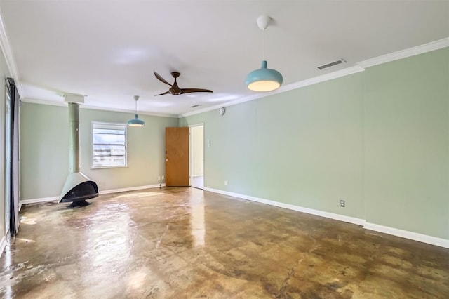 1610 Broadmoor Dr, Austin, TX 78723 - empty room featuring concrete floors, a wood stove, crown molding, and ceiling fan