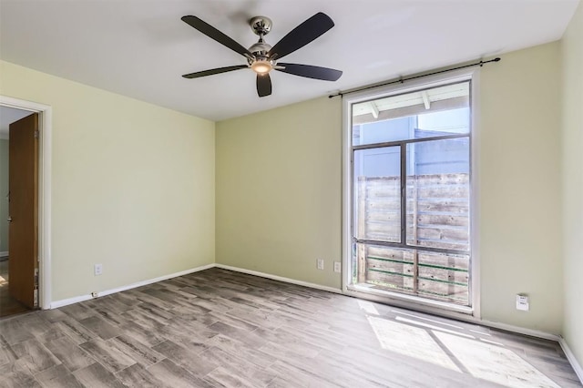 1610 Broadmoor Dr, Austin, TX 78723 - unfurnished room featuring wood finished floors and ceiling fan