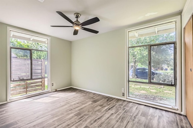 1610 Broadmoor Dr, Austin, TX 78723 - unfurnished room featuring wood finished floors and a ceiling fan