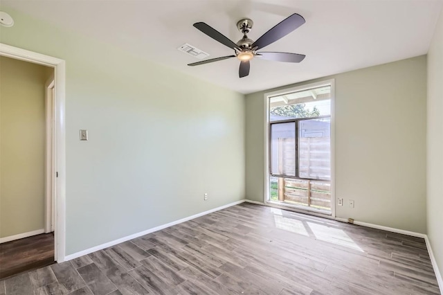1610 Broadmoor Dr, Austin, TX 78723 - spare room with wood finished floors, a ceiling fan, and a smoke detector