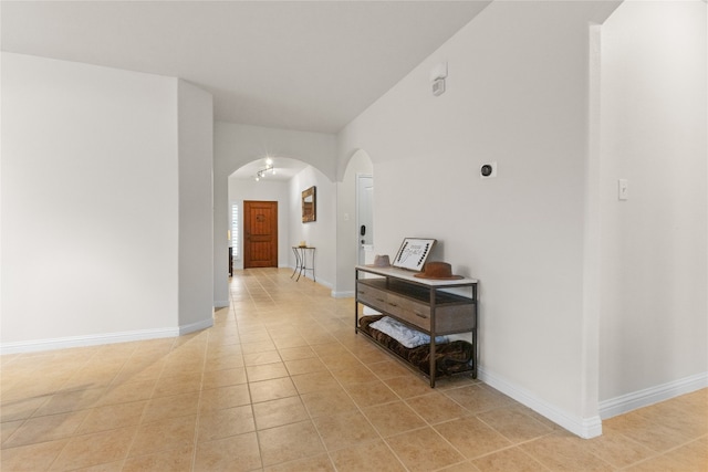 3308 Harvest Time Cv, Austin, TX 78754 - corridor with arched walkways and light tile patterned floors