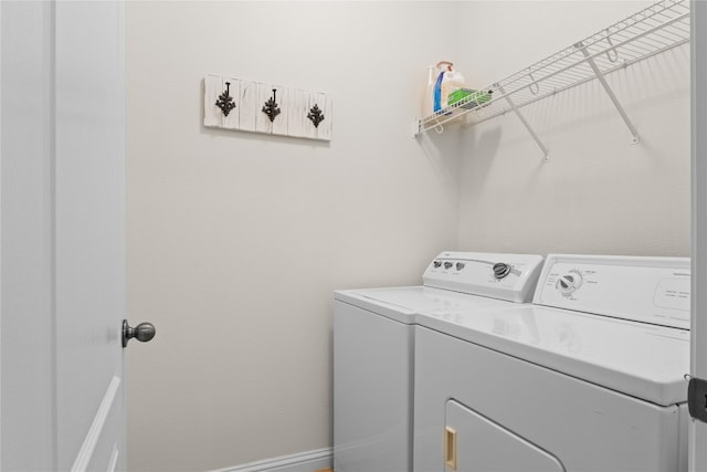 3308 Harvest Time Cv, Austin, TX 78754 - laundry area with washer and clothes dryer and baseboards