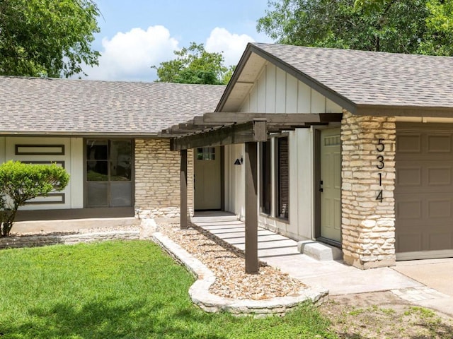 5314 Presidio Rd, Austin, TX 78745 - view of front of house featuring roof with shingles, a garage, stone siding, and board and batten siding