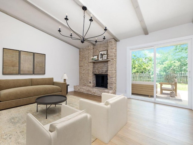 5314 Presidio Rd, Austin, TX 78745 - living room with a chandelier, light wood-style floors, and a fireplace