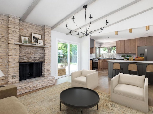 5314 Presidio Rd, Austin, TX 78745 - living area with beamed ceiling, healthy amount of natural light, light wood-style flooring, and a stone fireplace