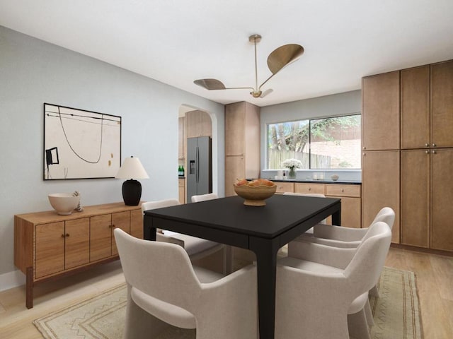 5314 Presidio Rd, Austin, TX 78745 - dining room featuring light wood-style floors and arched walkways