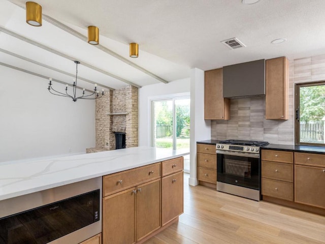 5314 Presidio Rd, Austin, TX 78745 - kitchen featuring stainless steel gas range oven, beam ceiling, light wood-style floors, decorative backsplash, and light stone counters