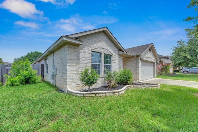 109 Inman Dr, Hutto, TX 78634 - view of front of home featuring an attached garage, stone siding, and driveway
