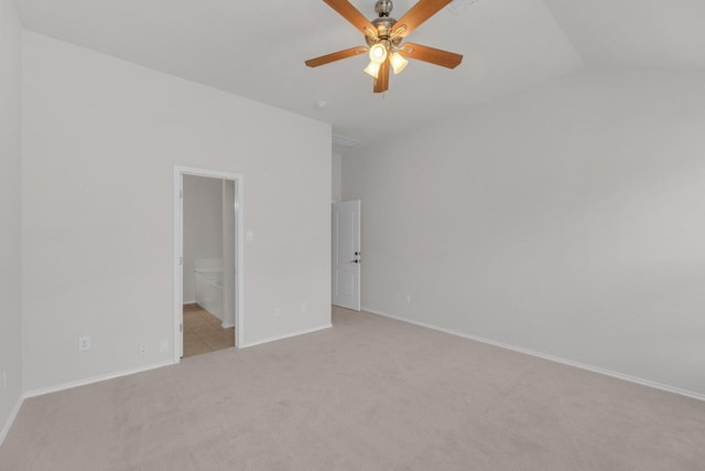 109 Inman Dr, Hutto, TX 78634 - unfurnished bedroom featuring light carpet, connected bathroom, lofted ceiling, and ceiling fan
