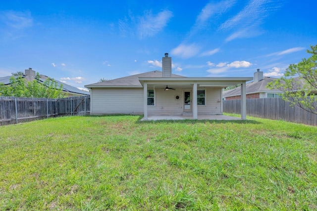 109 Inman Dr, Hutto, TX 78634 - rear view of house with a ceiling fan, a patio area, a fenced backyard, and a chimney