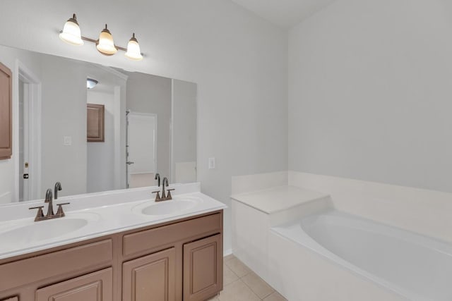 109 Inman Dr, Hutto, TX 78634 - full bath featuring double vanity, tile patterned floors, and a garden tub