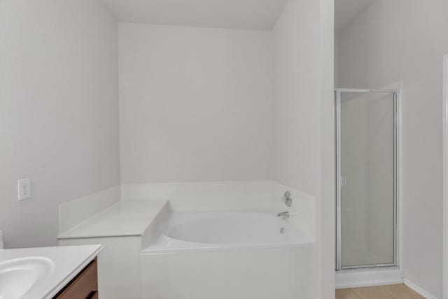109 Inman Dr, Hutto, TX 78634 - full bath featuring vanity, a shower stall, a bath, and tile patterned flooring