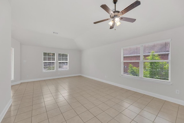 109 Inman Dr, Hutto, TX 78634 - unfurnished room featuring healthy amount of natural light, vaulted ceiling, a ceiling fan, and light tile patterned floors