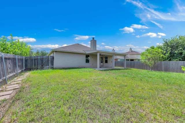 109 Inman Dr, Hutto, TX 78634 - rear view of property featuring a patio area, a chimney, and a fenced backyard