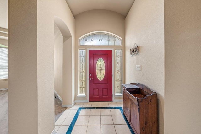 106 Mesquite Trl, Boerne, TX 78006 - foyer entrance featuring light tile patterned flooring, vaulted ceiling, and arched walkways
