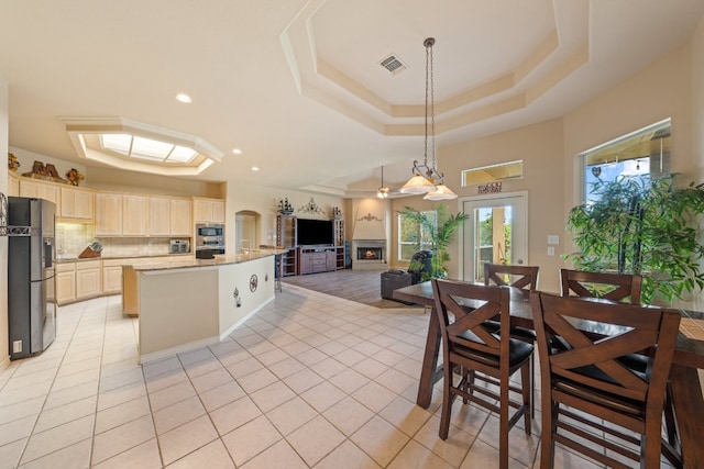 106 Mesquite Trl, Boerne, TX 78006 - kitchen with a raised ceiling, appliances with stainless steel finishes, open floor plan, light tile patterned floors, and recessed lighting