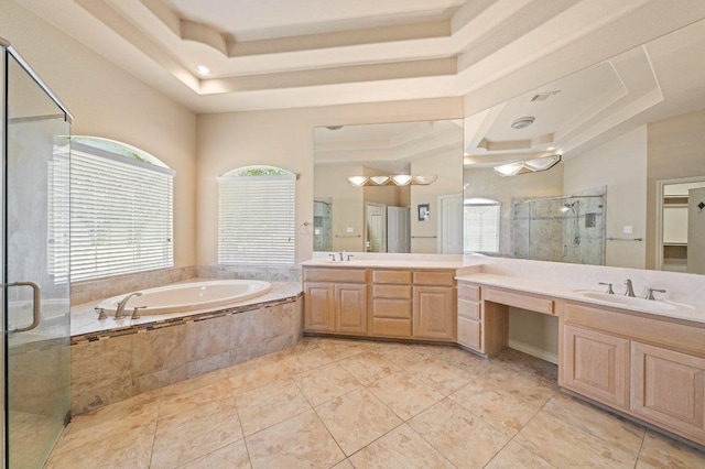106 Mesquite Trl, Boerne, TX 78006 - bathroom featuring a raised ceiling, vanity, a garden tub, and a stall shower