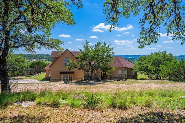 106 Mesquite Trl, Boerne, TX 78006 - rear view of house featuring stucco siding and french doors
