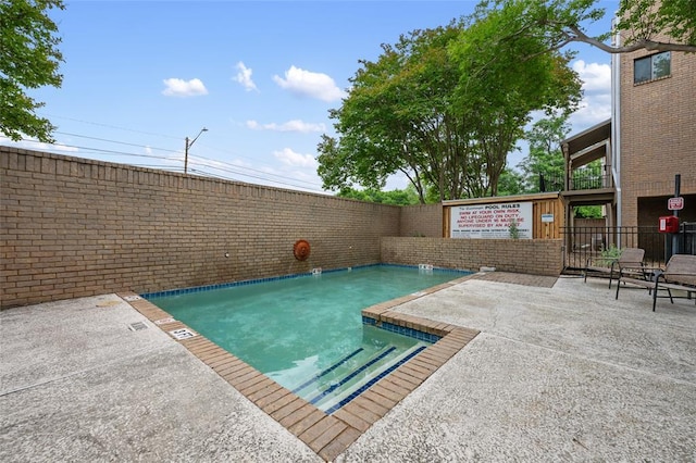 611 E 45th St Unit 8, Austin, TX 78751 - view of swimming pool with a fenced backyard