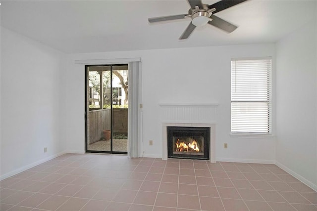 611 E 45th St Unit 8, Austin, TX 78751 - unfurnished living room featuring a lit fireplace and a ceiling fan