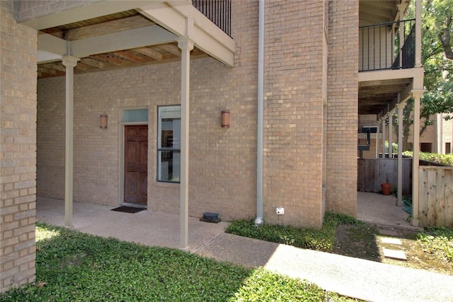 611 E 45th St Unit 8, Austin, TX 78751 - view of exterior entry featuring a balcony and a patio area