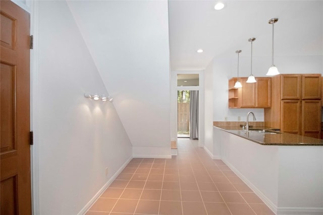 611 E 45th St Unit 8, Austin, TX 78751 - kitchen with pendant lighting, open shelves, recessed lighting, and brown cabinets