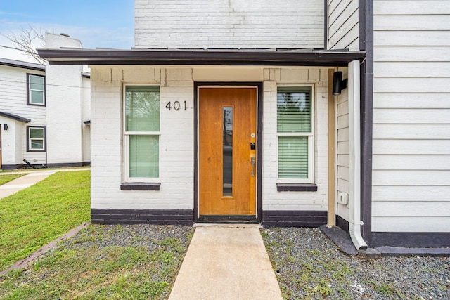 2706 Wheless Ln Unit 401, Austin, TX 78723 - doorway to property featuring brick siding