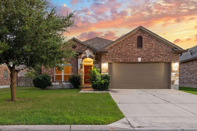 18712 Leigh Ln, Pflugerville, TX 78660 - french country style house with concrete driveway, a garage, brick siding, and stone siding
