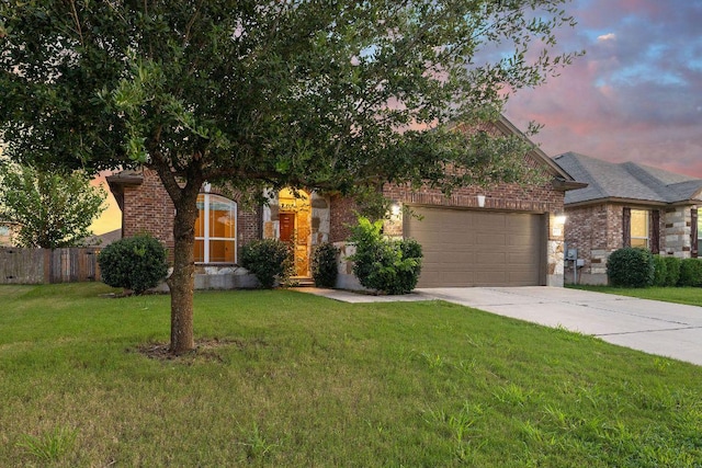 18712 Leigh Ln, Pflugerville, TX 78660 - view of property hidden behind natural elements featuring a garage, brick siding, and driveway