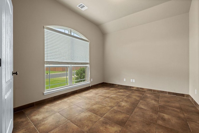 18712 Leigh Ln, Pflugerville, TX 78660 - empty room featuring plenty of natural light and vaulted ceiling