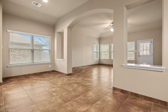 18712 Leigh Ln, Pflugerville, TX 78660 - spare room with ceiling fan, tile patterned flooring, arched walkways, and vaulted ceiling