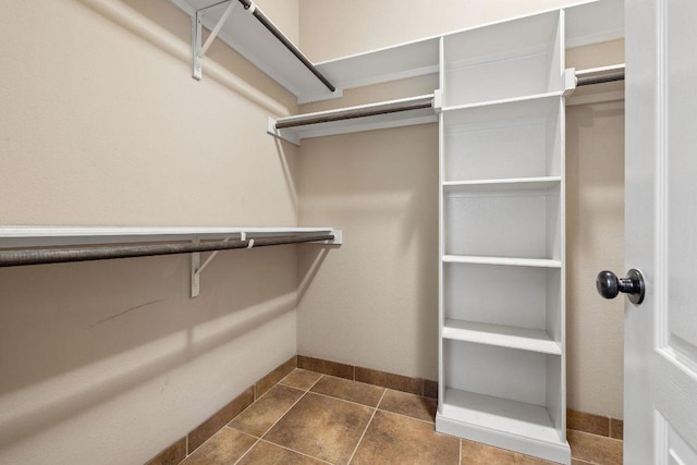 18712 Leigh Ln, Pflugerville, TX 78660 - spacious closet with dark tile patterned floors