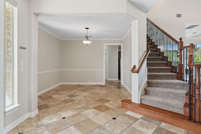 7204 Covered Bridge Dr, Austin, TX 78736 - foyer with stone tile floors, stairway, and crown molding