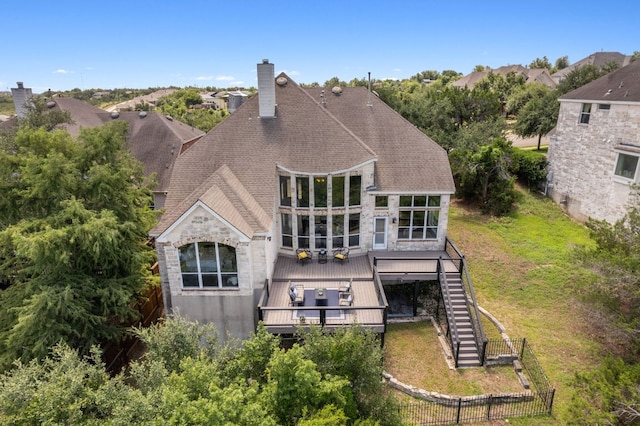 7204 Covered Bridge Dr, Austin, TX 78736 - back of property featuring a wooden deck, a chimney, stone siding, and stairs