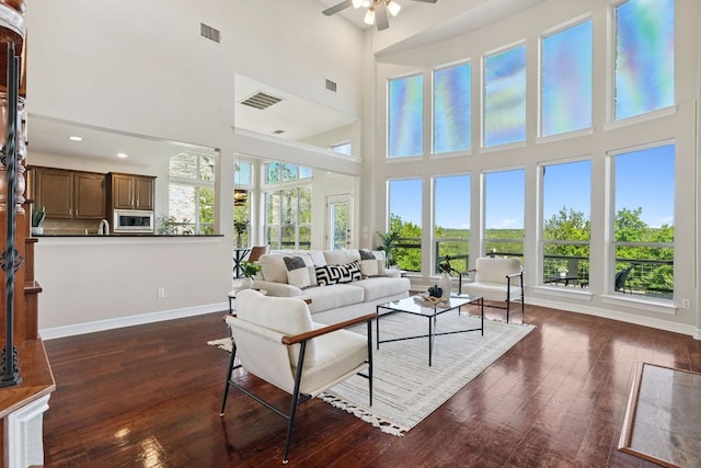 7204 Covered Bridge Dr, Austin, TX 78736 - living room with ceiling fan, a high ceiling, dark wood-style floors, and recessed lighting