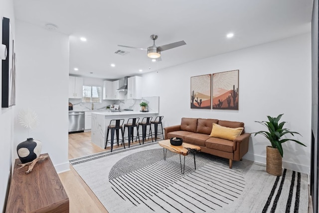 2706 Wheless Ln Unit 502, Austin, TX 78723 - living area with a ceiling fan, light wood-style floors, and recessed lighting