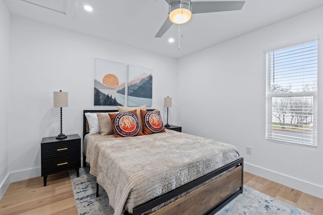 2706 Wheless Ln Unit 502, Austin, TX 78723 - bedroom with light wood-style floors, multiple windows, a ceiling fan, and recessed lighting